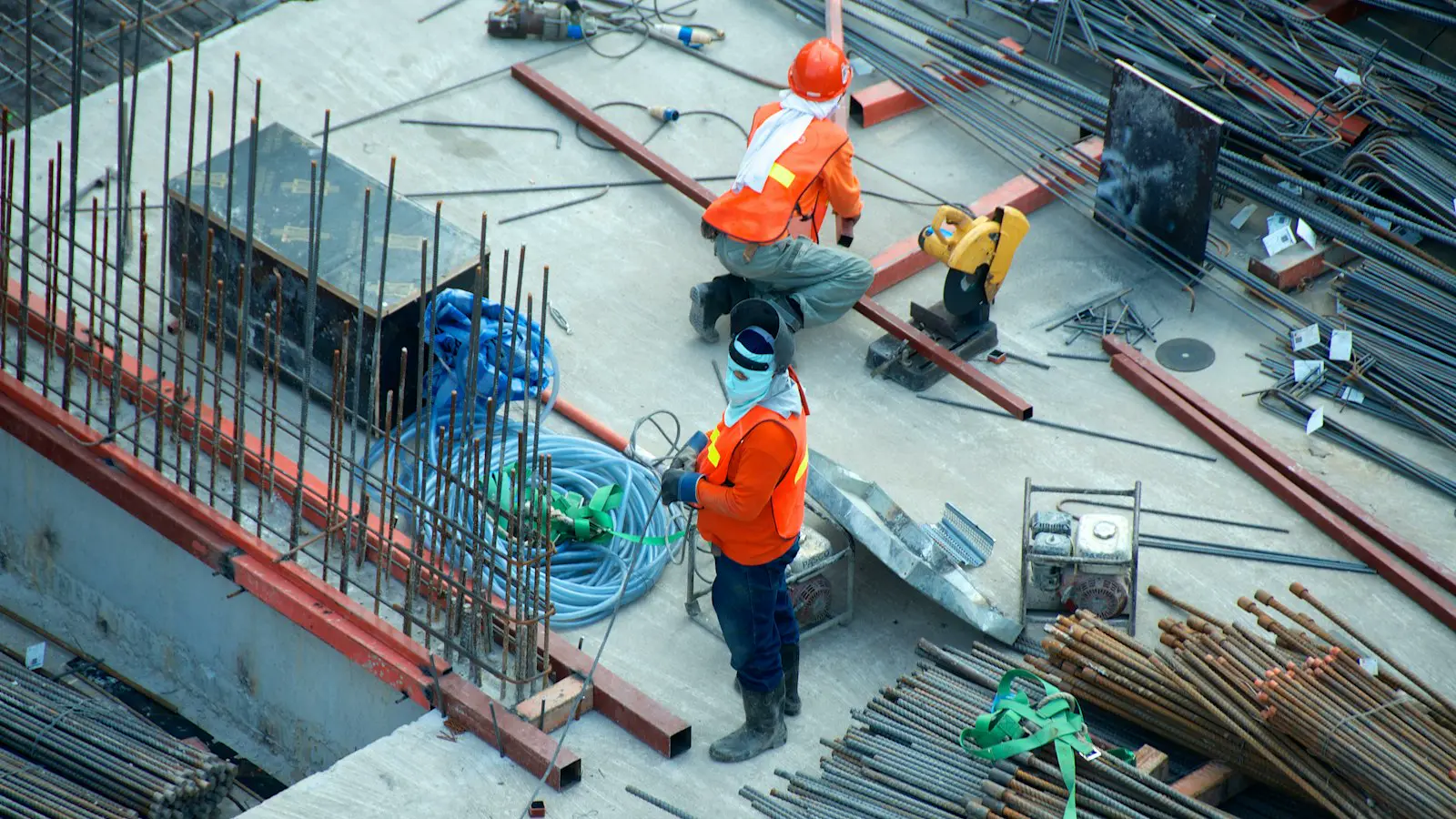 Contractors working on a commercial jobsite with steel and concrete