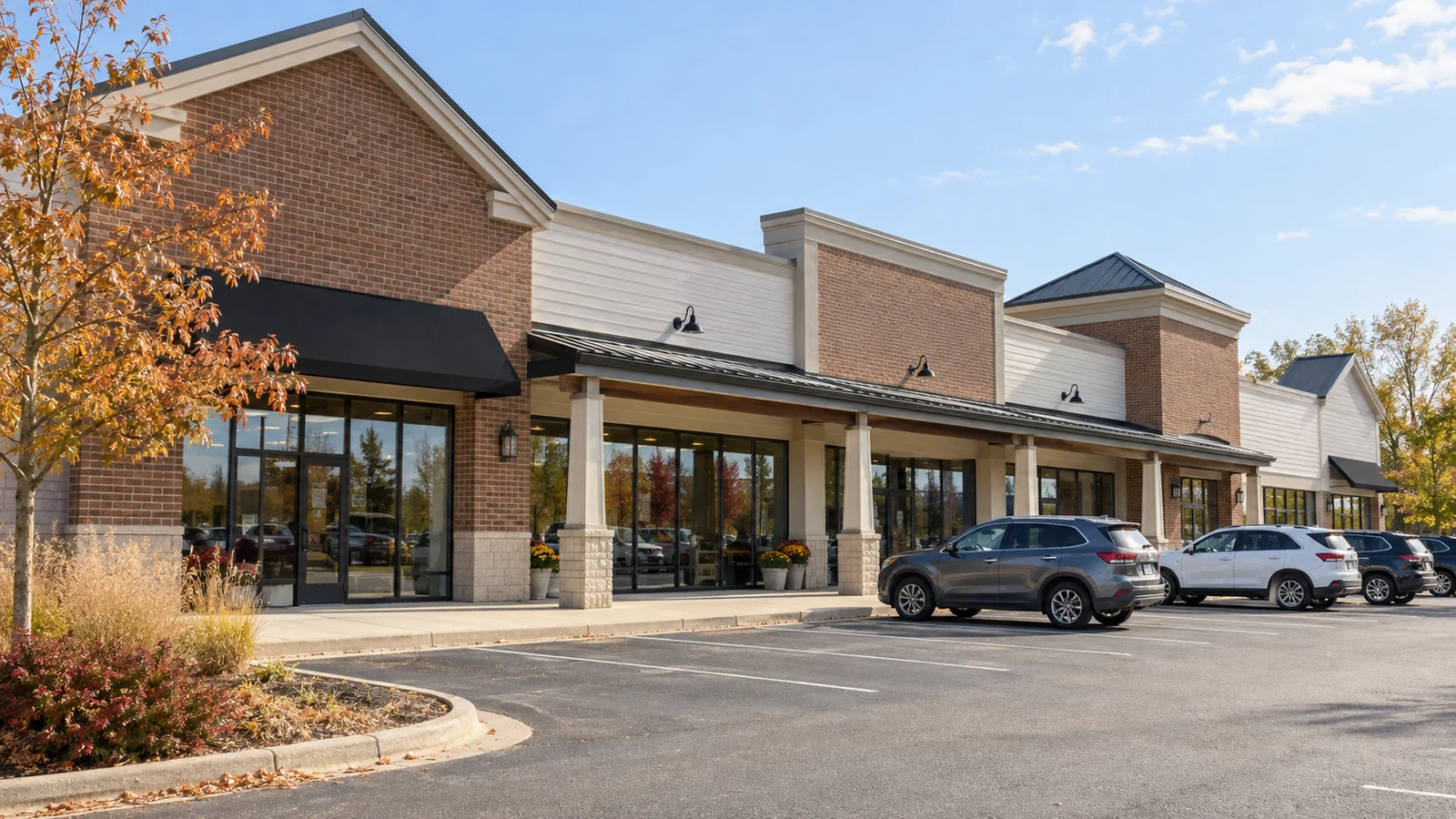 Illustrative retail strip center with storefronts and parking; AI-generated image, not a client property.